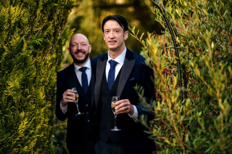 Grooms portrait in the garden at dusk at Edes House, Chichester