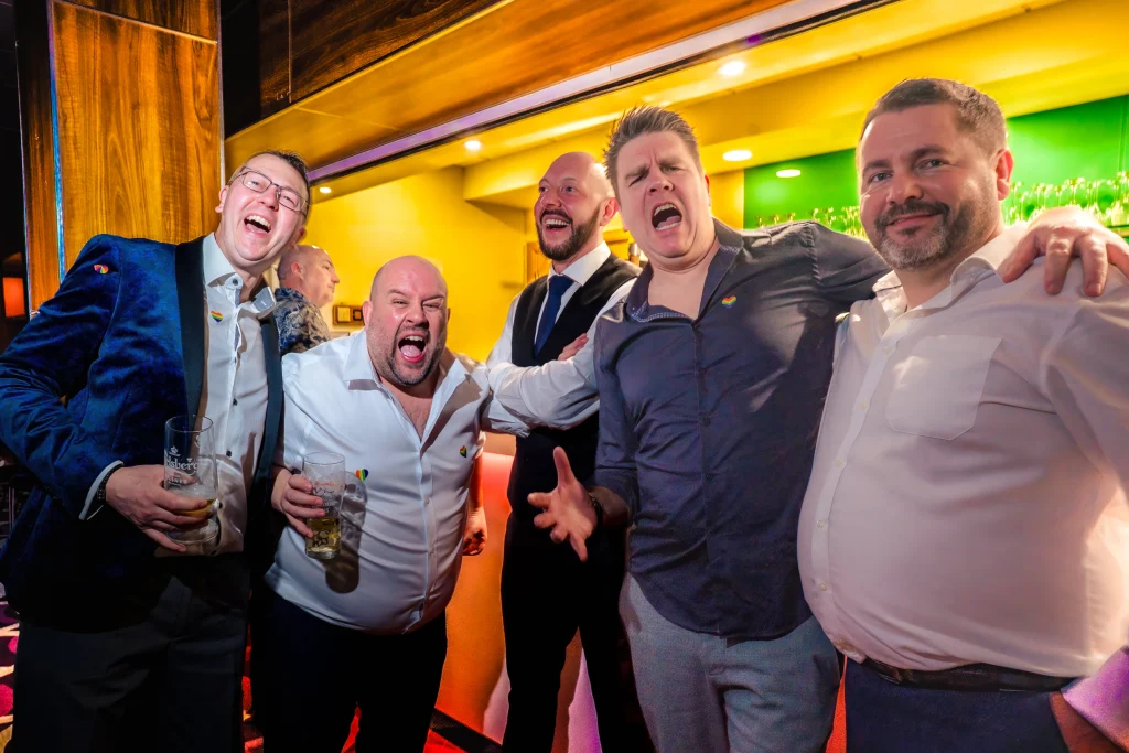 Guests laughing together at the evening do at Edes House, Chichester