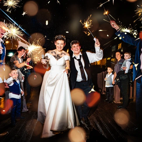 Sparkler exit at Toni and Vikki's winter vow renewal at Newtown House Hotel, Hayling Island