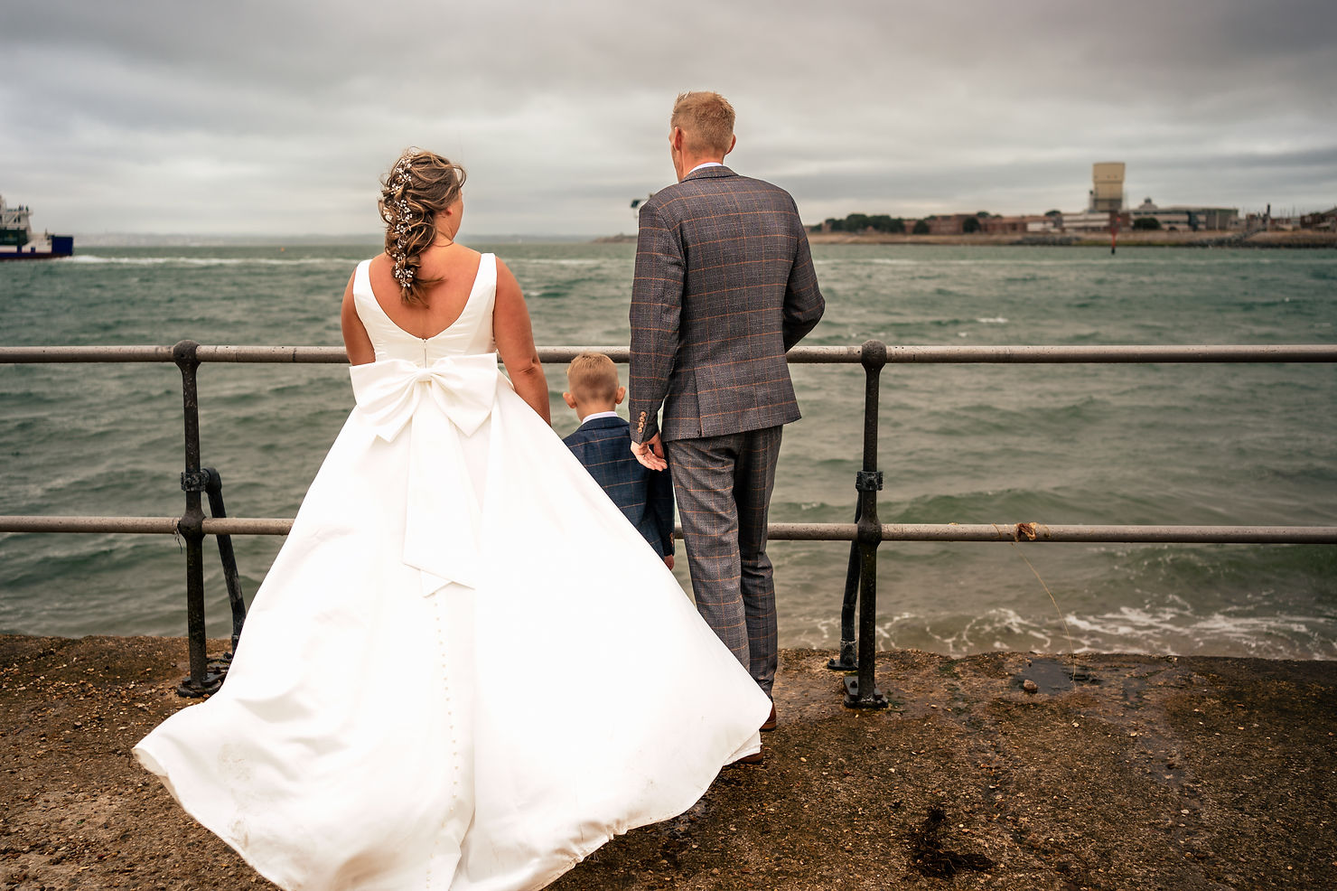 Bride and groom by the sea near The Square Tower Old Portsmouth