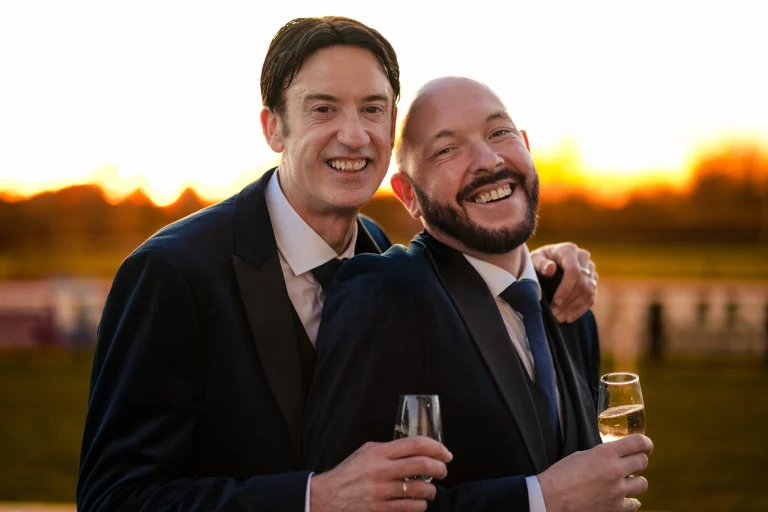 Two grooms at golden hour at Edes House, Chichester