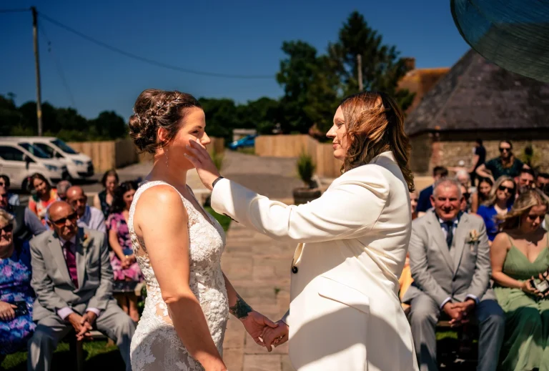 Bride wipes brides tear at same sex wedding Southlands Barn