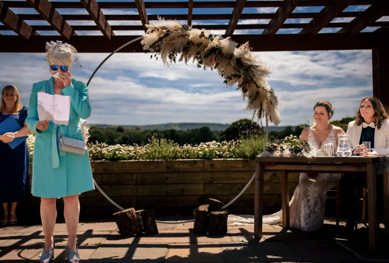 Mum upset giving a reading at outdoor ceremony at Southlands Barn