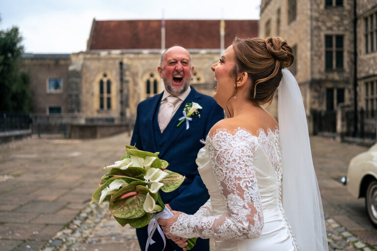 Candid moment outside Winchester Registry office Micro wedding