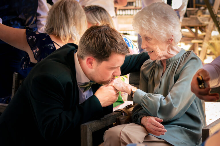 Candid moment between groom and nan at Kimbridge Barn Hampshire