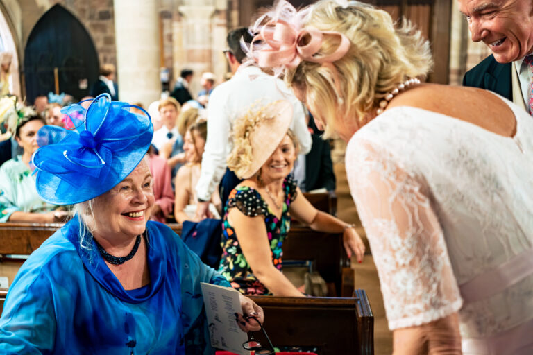 Happy exchange in church documentary wedding photography