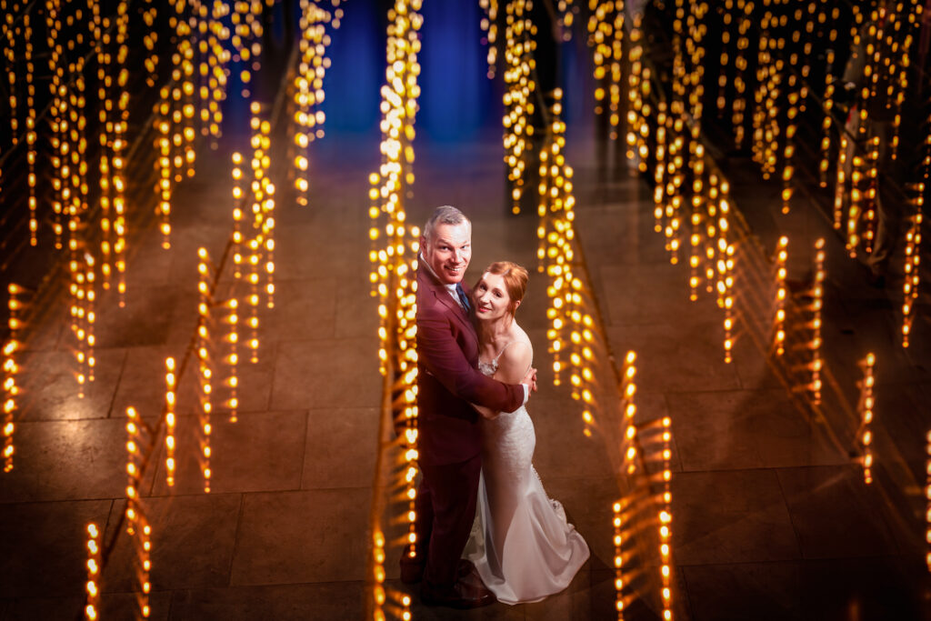 Couple under a fairy light shower shutter drag The Post Barn 