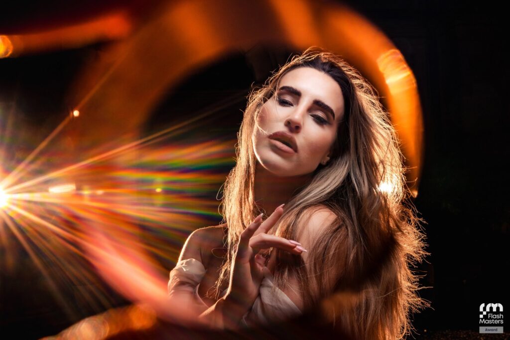 Dramatic backlit bride portrait with prism light rays, Flash Masters award winning