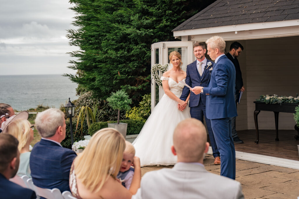 Outdoor wedding ceremony by the gazebo overlooking the sea at Hotel Miramar Bournemouth