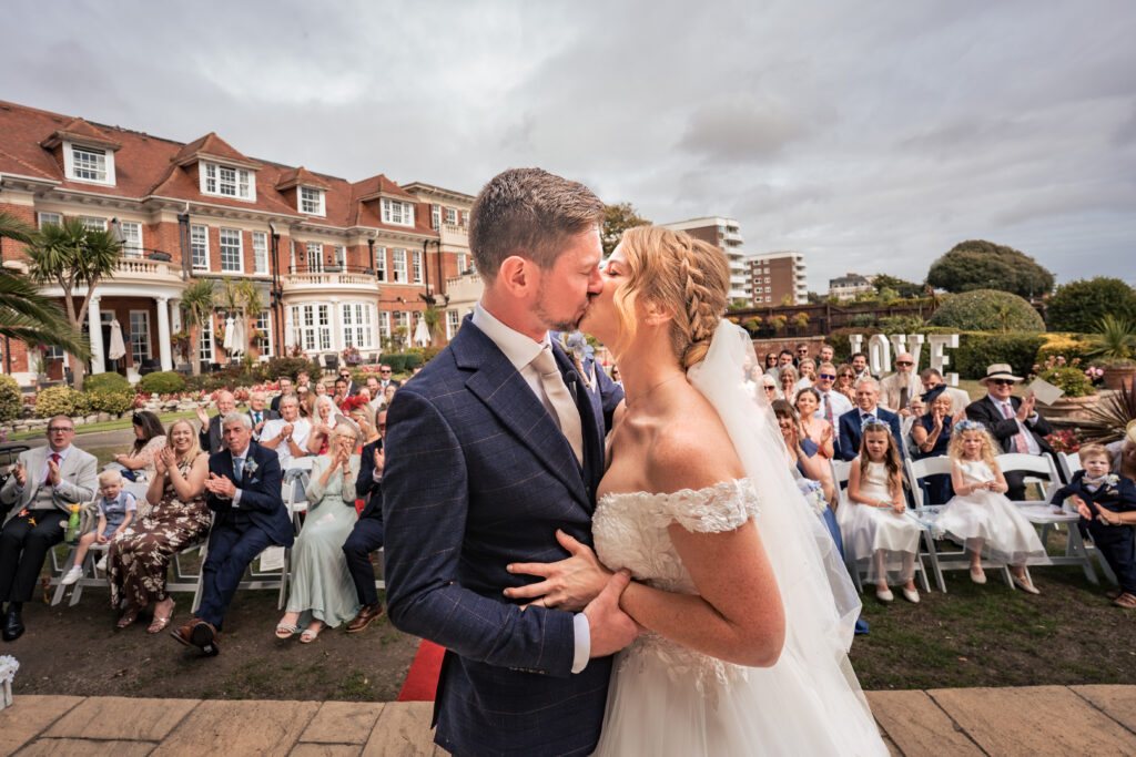 First kiss at the outdoor wedding ceremony at Hotel Miramar Bournemouth