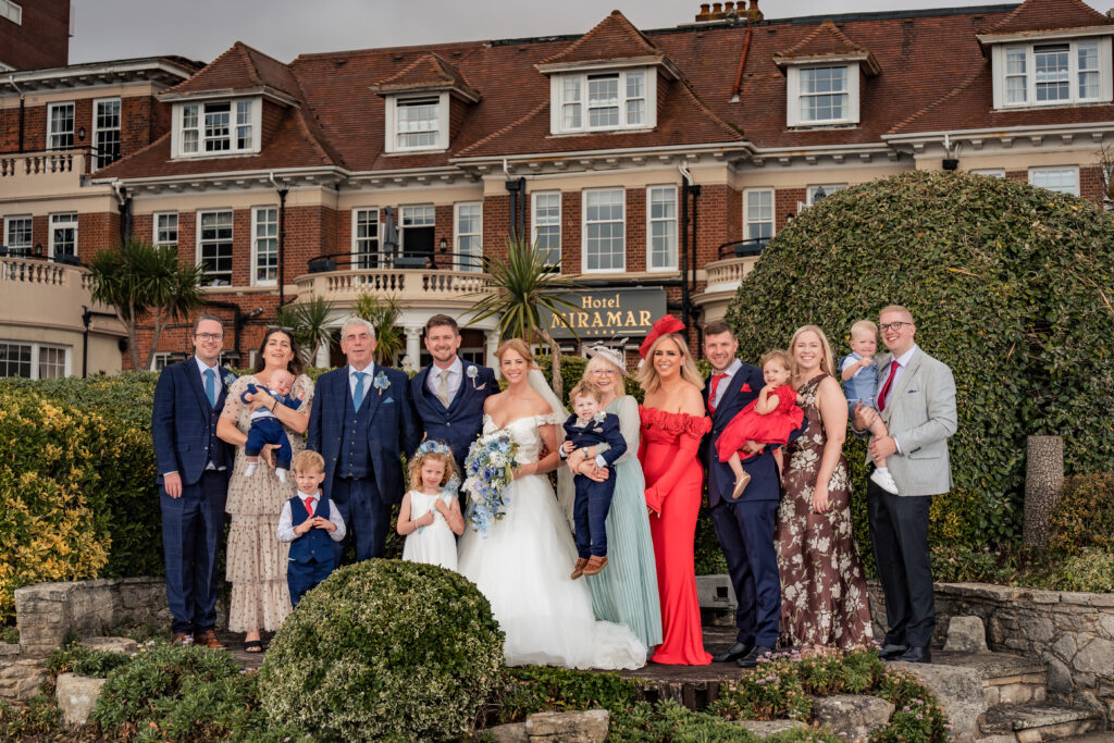Flash lit family formal photo outside Hotel Miramar Bournemouth