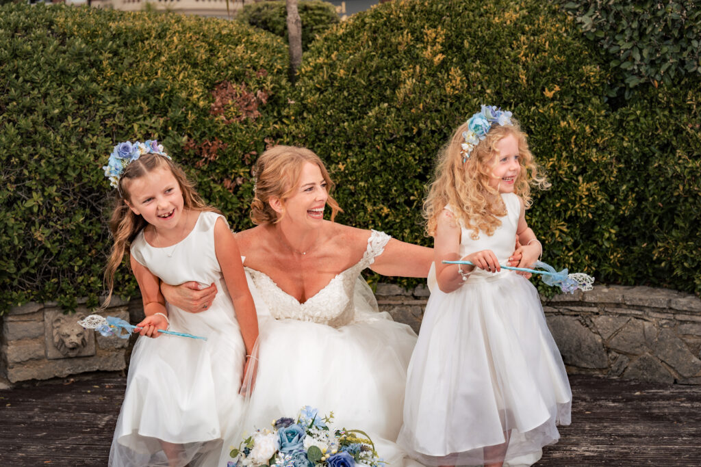 Bride laughing with her flower girls at Hotel Miramar Bournemouth
