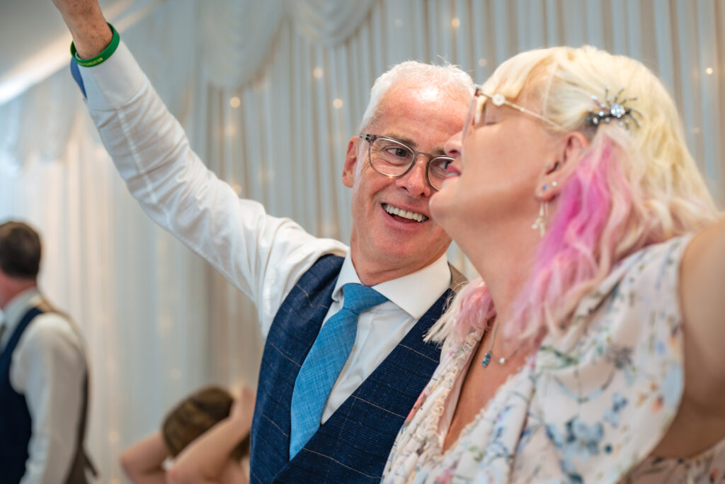 Guests cheering during the wedding breakfast at Hotel Miramar Bournemouth