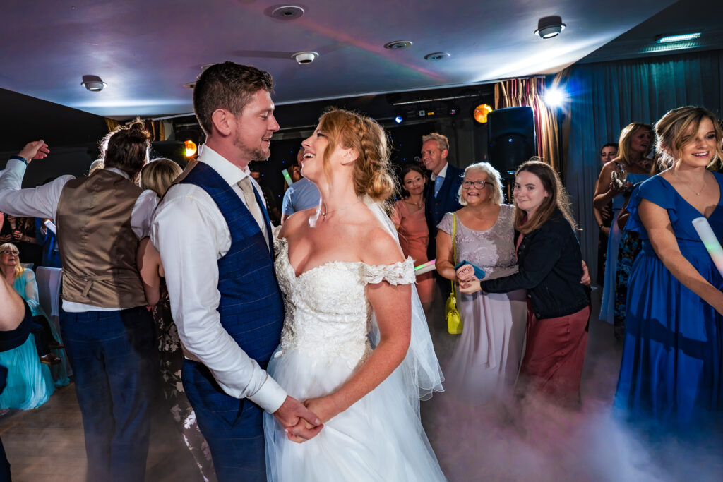 Bride and groom first dance surrounded by guests at Hotel Miramar