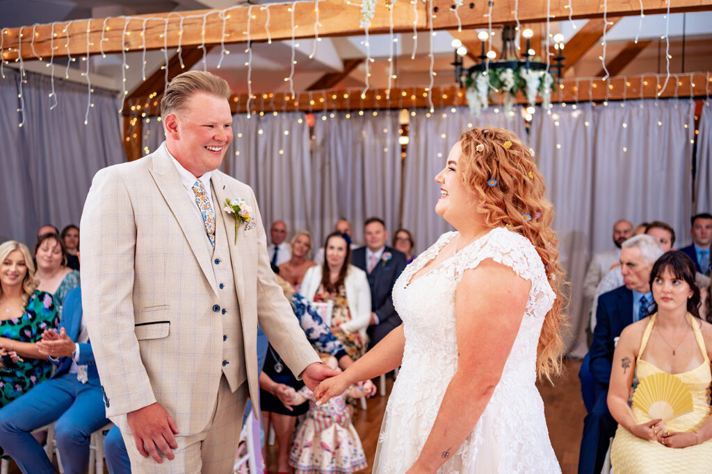Bride and groom during their flash-lit ceremony at Newtown House Hotel, Hayling Island