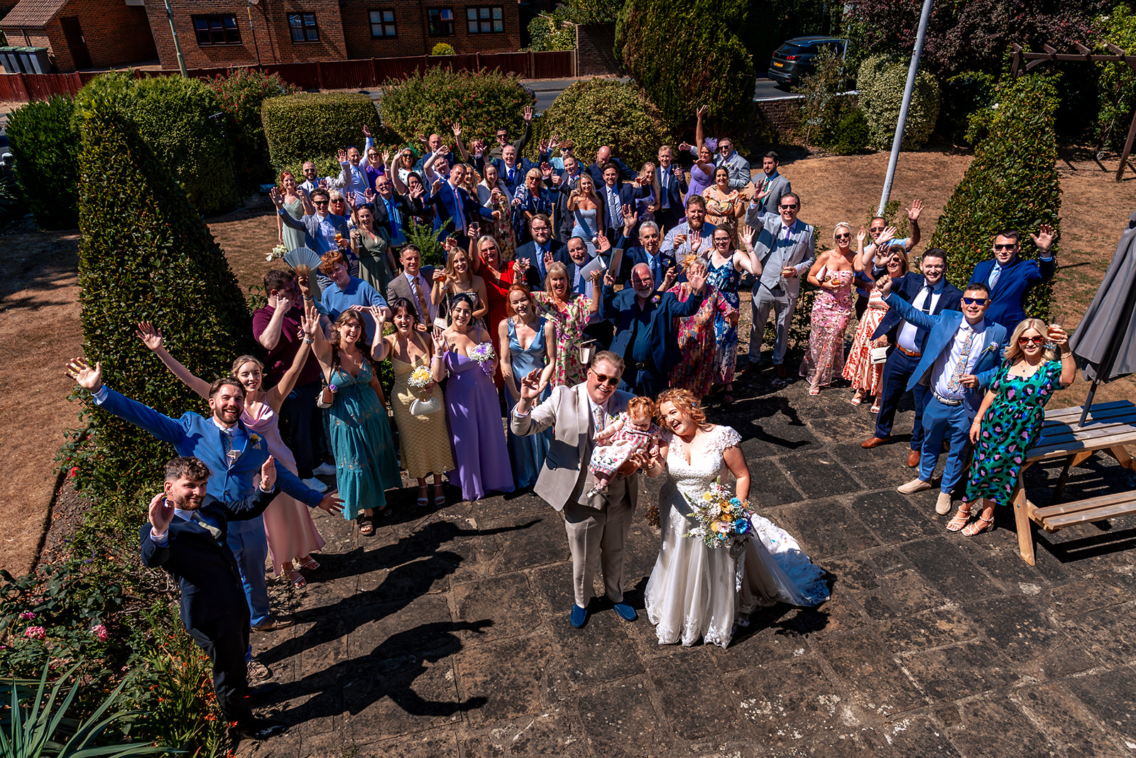 Group photo of all the wedding guests from above at Newtown House Hotel, Hayling Island