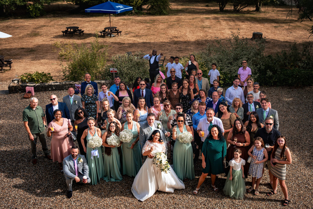 Big wedding group photo at Farnham House Hotel, Surrey