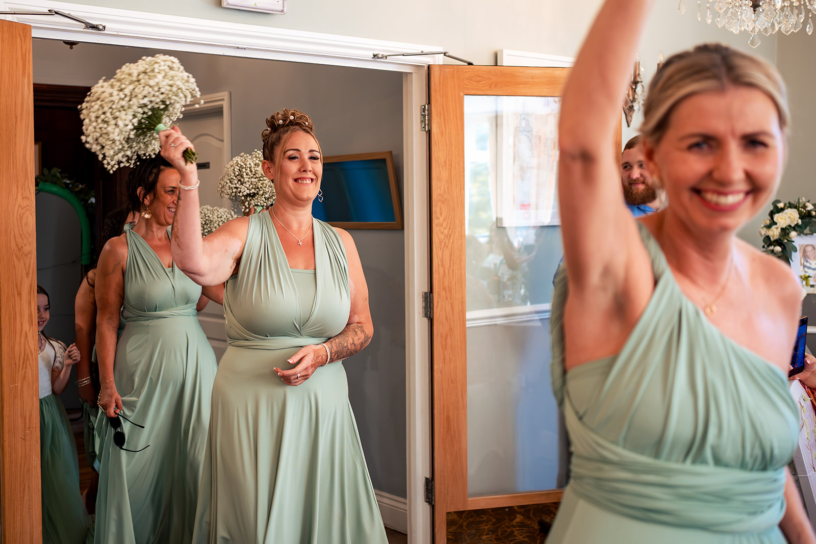Bridesmaids getting ready before a Farnham House Hotel wedding, Surrey
