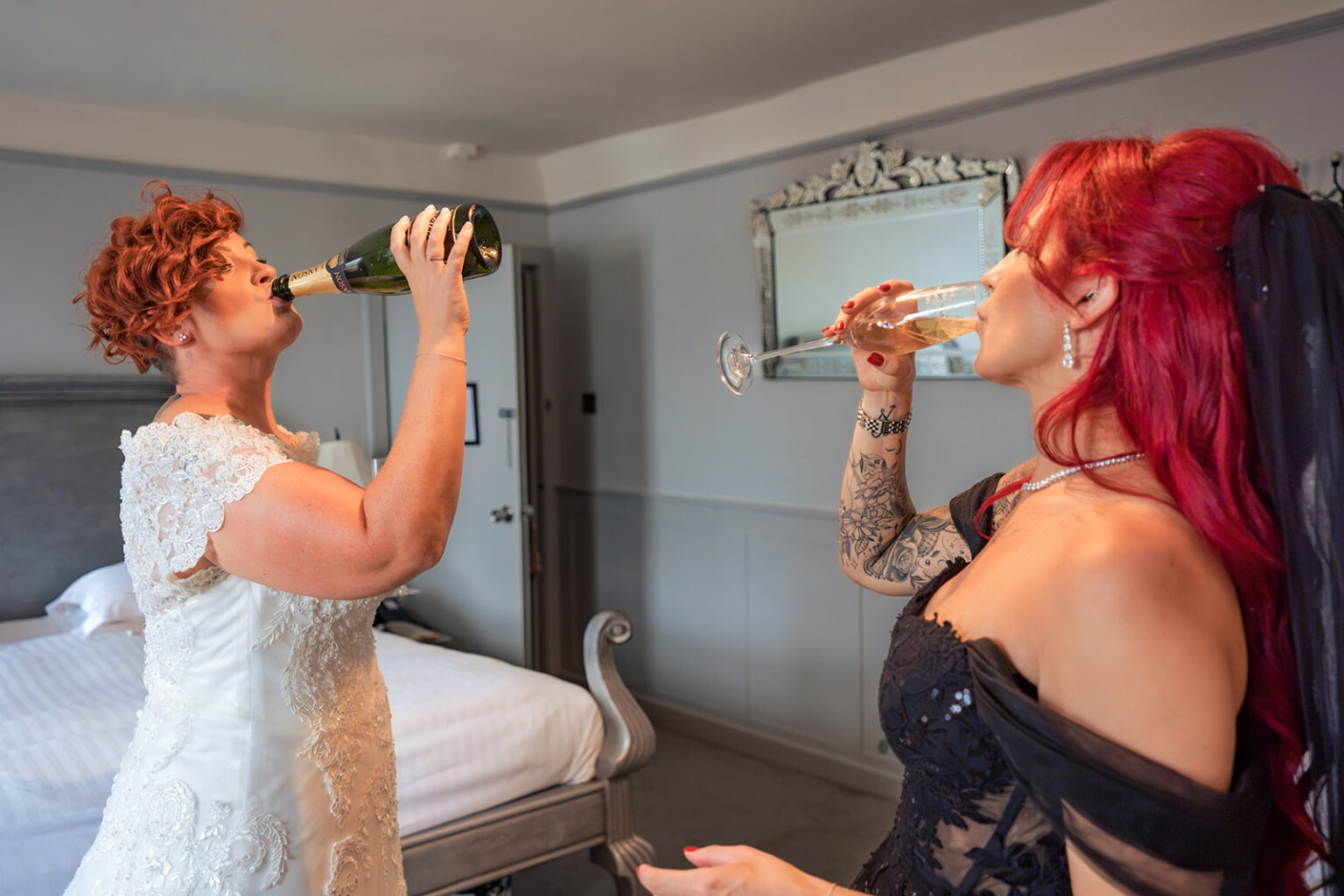 Two brides toasting on their wedding day at The Elephant at Pangbourne, Berkshire