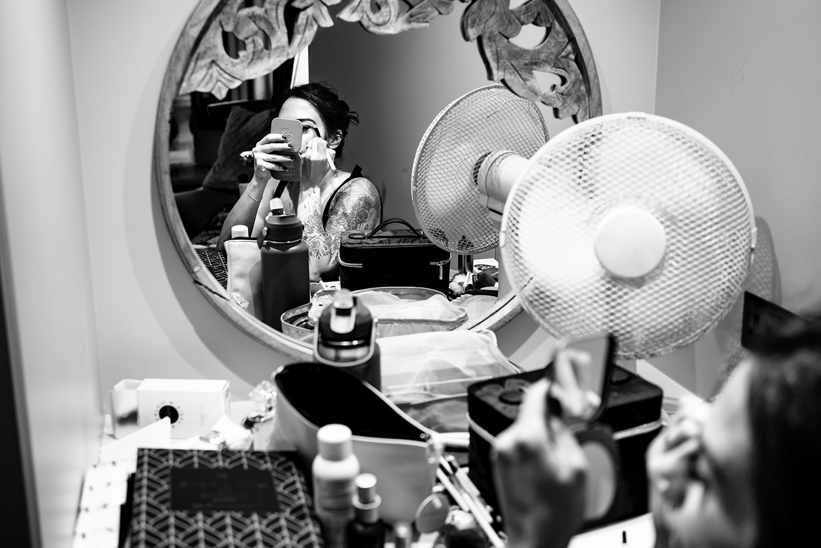Bride doing her own makeup before her wedding at The Elephant at Pangbourne, Berkshire