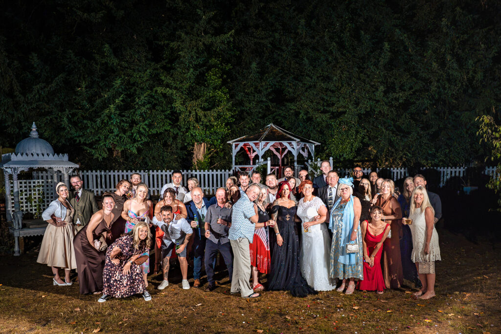 Large flash-lit group photo in the garden at The Elephant at Pangbourne, Berkshire
