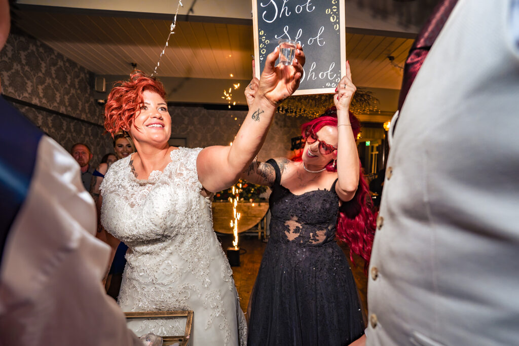 Bride with the shot trolley at a wedding at The Elephant at Pangbourne, Berkshire