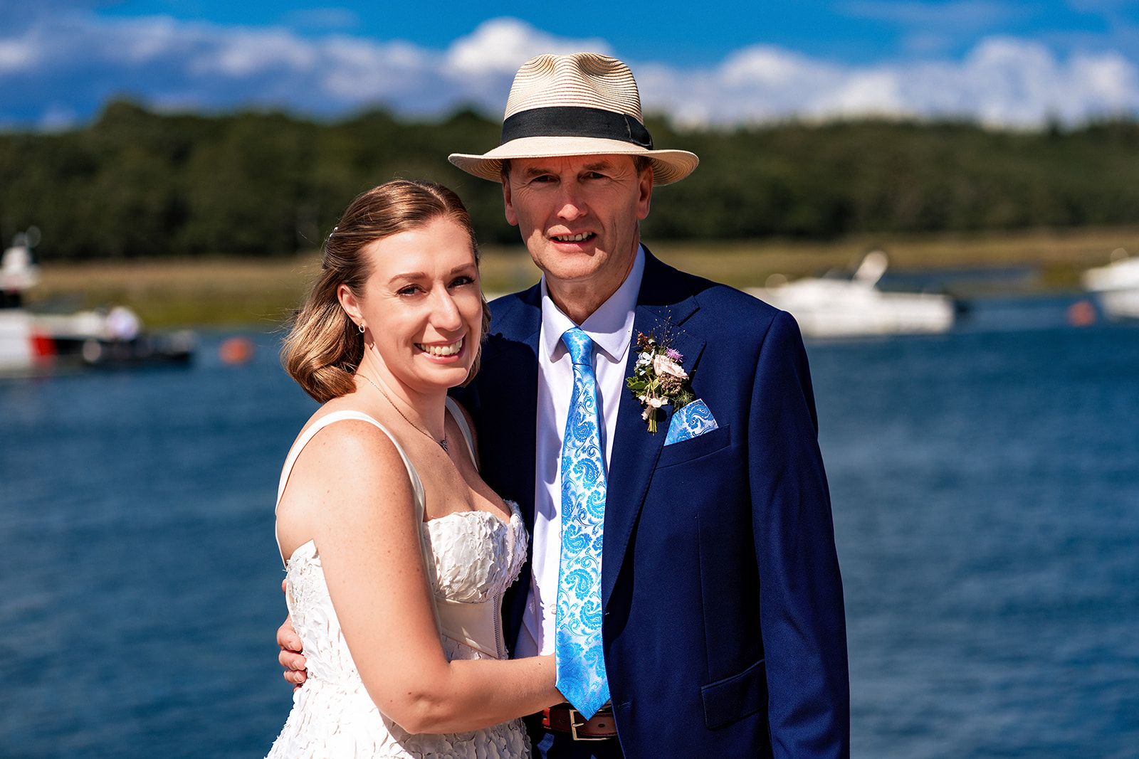 Bride and groom by the Beaulieu River at their Master Builder's wedding, Buckler's Hard