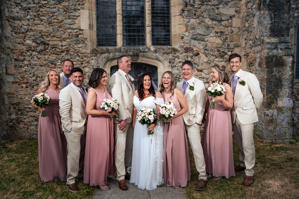 Flash lit family group photo outside St Thomas à Becket Church, Warblington