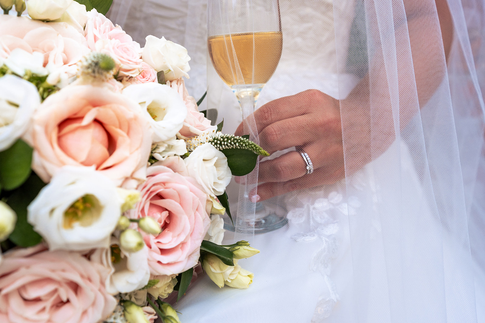 Wedding rings and bridal bouquet detail from Sally and Dave's micro wedding
