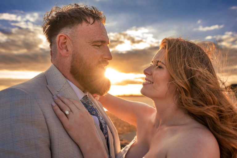 Bride and groom close-up portrait at sunset on Southsea seafront