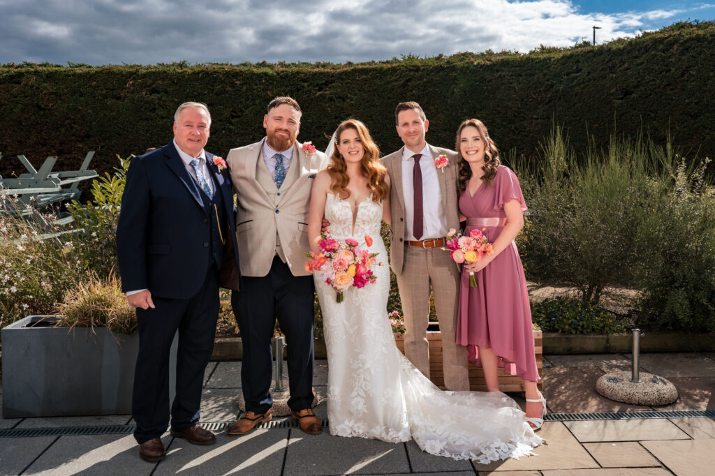 Bride and groom with family at The Queens Hotel Southsea