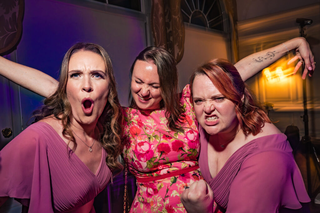 Guests pulling funny faces on the dancefloor at The Queens Hotel