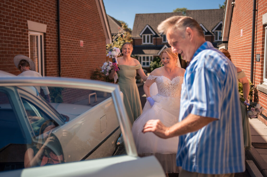 Bride arriving with her dad by wedding car in Old Portsmouth