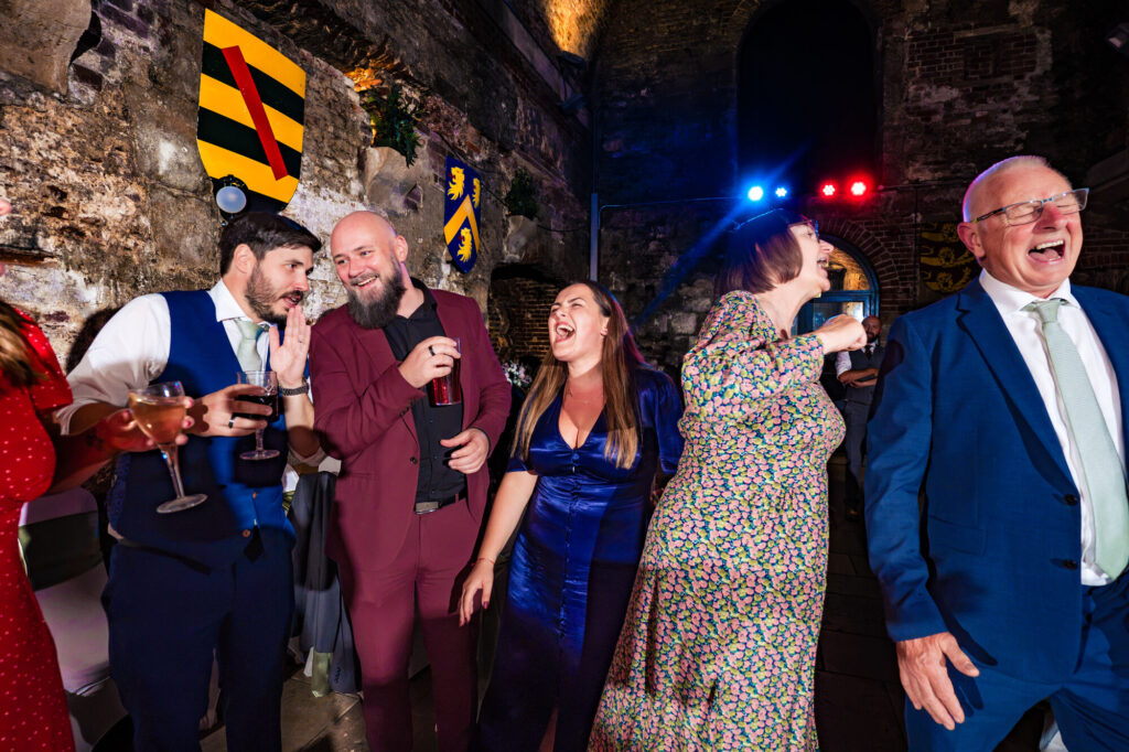 Bride laughing with her friends at her Square Tower Old Portsmouth wedding