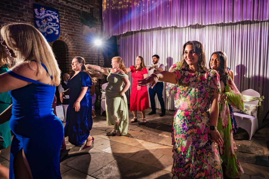Flash-lit evening dance floor at a Square Tower Old Portsmouth wedding
