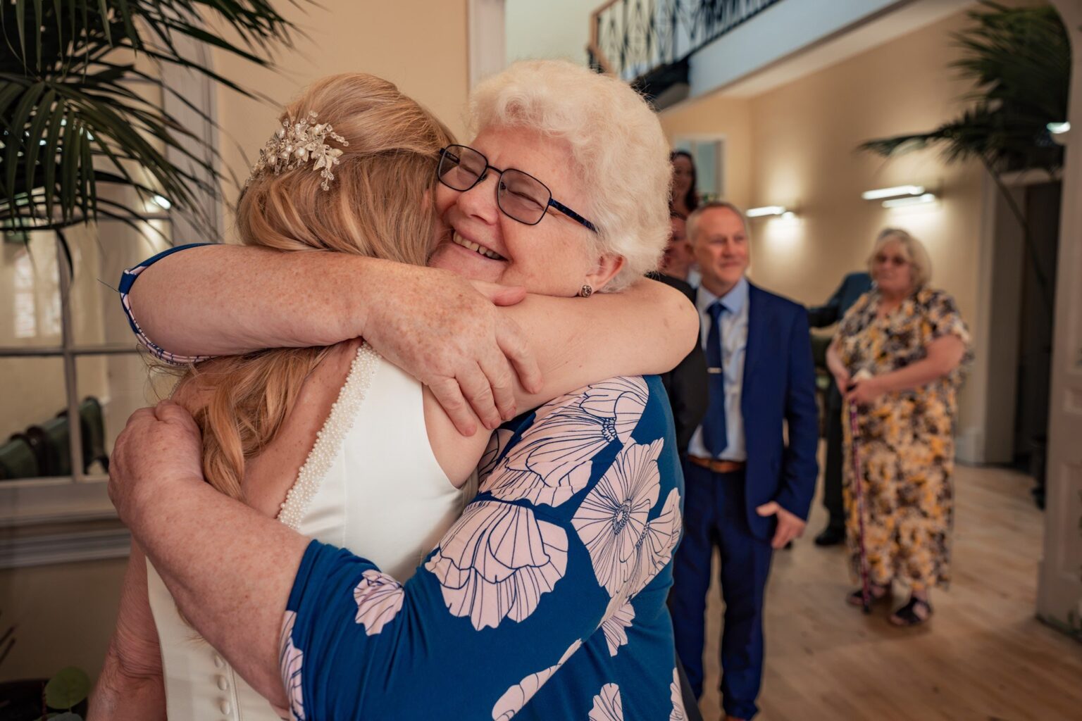 Bride sharing a big hug with a guest at Skylark Golf and Country Club