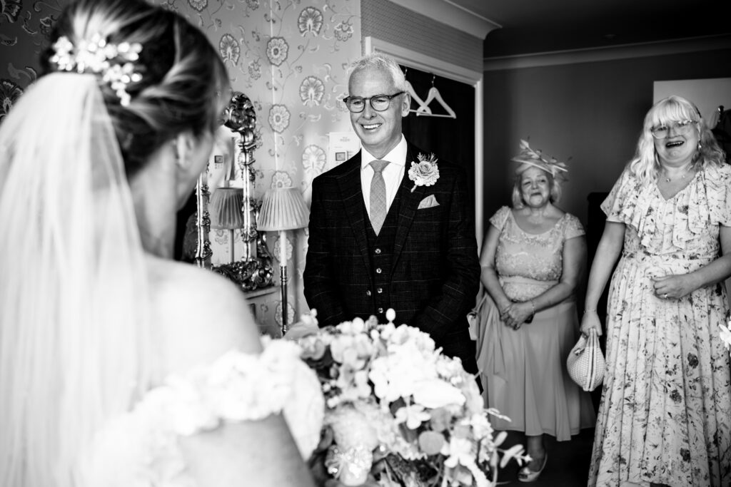 Bride with her dad and guests at Hotel Miramar Bournemouth, black and white