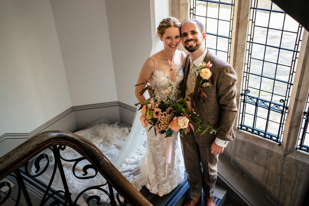 Bride and groom on the spiral staircase at Winchester Register Office, Hampshire