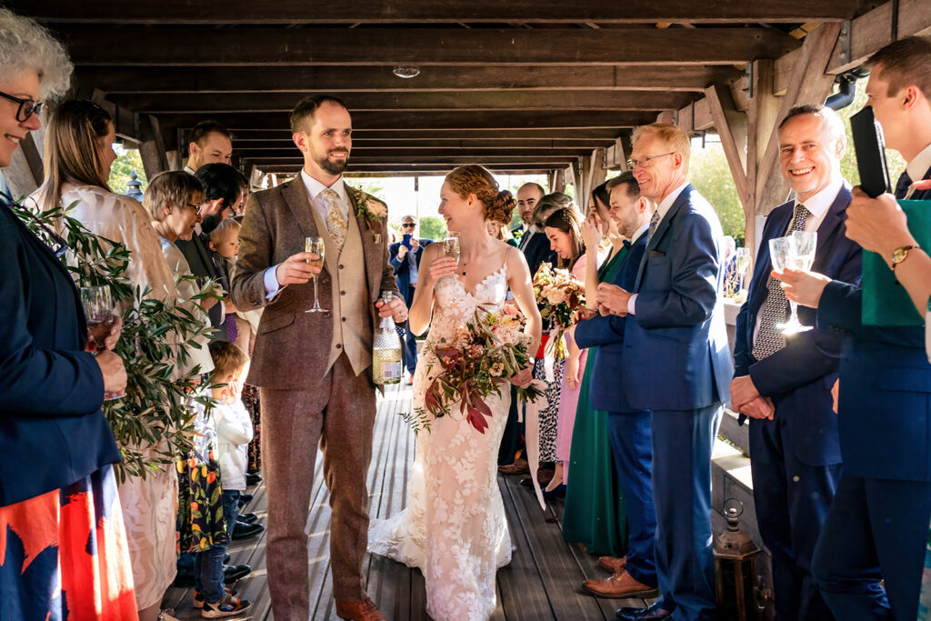 Guests celebrating in the barn at Kimbridge Barn, Test Valley, Hampshire