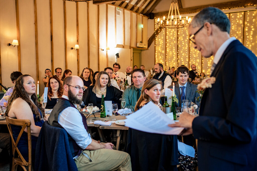 Guests listening to the speeches at Kimbridge Barn, Test Valley, Hampshire