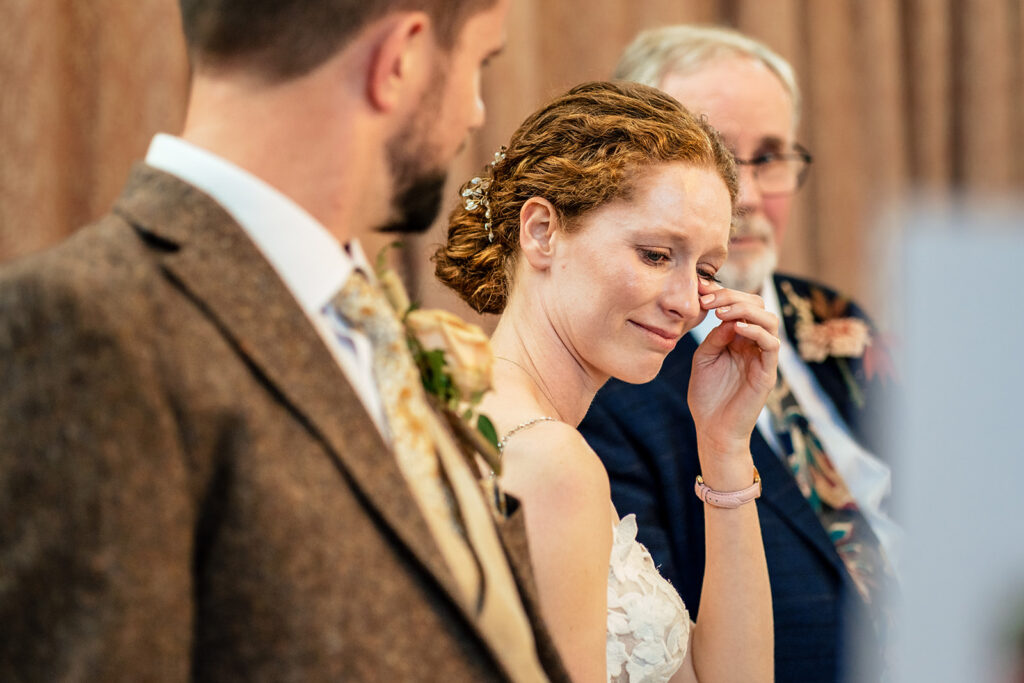 Bride and groom laughing during the speeches at Kimbridge Barn, Test Valley, Hampshire