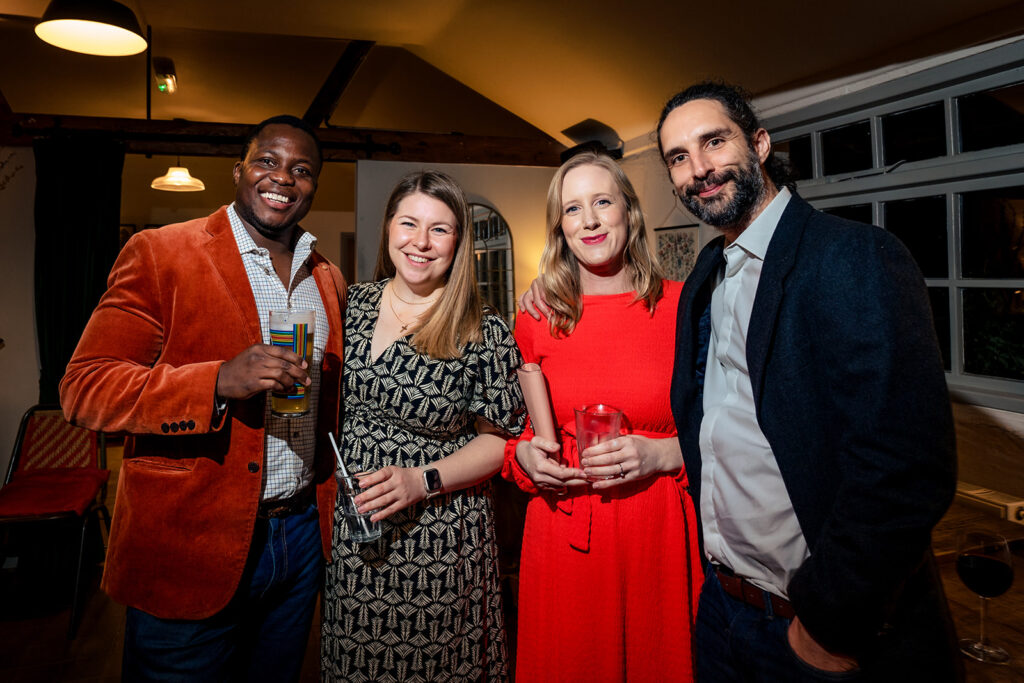 Guests posing together at the evening reception at Kimbridge Barn, Test Valley, Hampshire