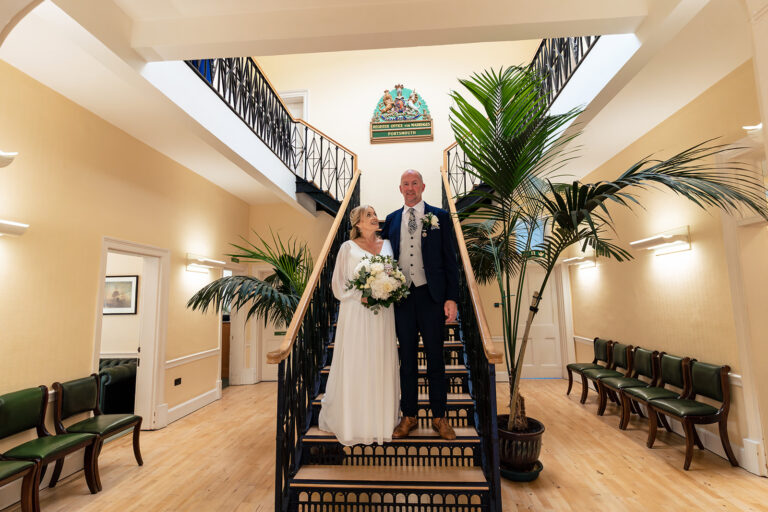 Bride walking up the staircase at Portsmouth Register Office, Hampshire