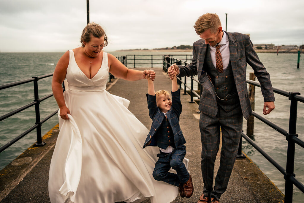Bride and groom dancing by the sea at The Square Tower, Old Portsmouth