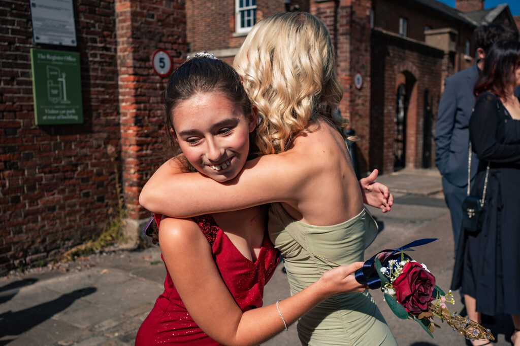 Bridesmaids hugging outside Portsmouth Register Office