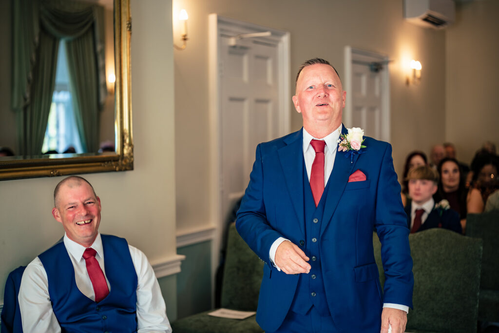 Groom waiting at the front of the ceremony room at Portsmouth Register Office, Hampshire