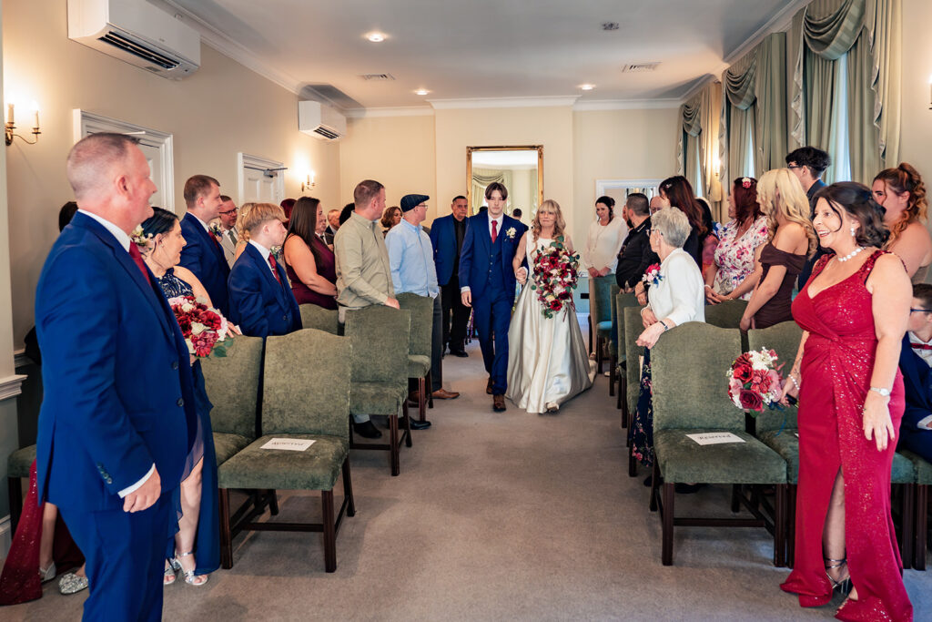 Bride walking down the aisle at Portsmouth Register Office, Hampshire