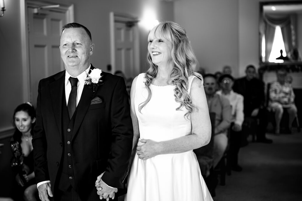 Bride and groom during the ceremony, black and white, at Portsmouth Register Office, Hampshire
