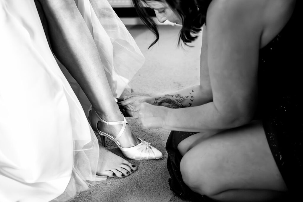Bride getting ready, black and white, on the morning of a Portsmouth wedding