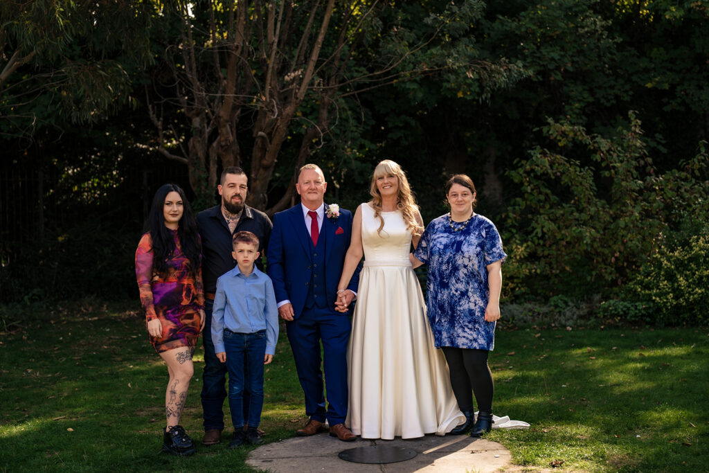 Family group photo in the gardens at Portsmouth Register Office, Hampshire
